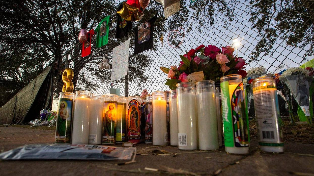 Candles are lit at a makeshift memorial on November 7, 2021 at the NRG Park grounds