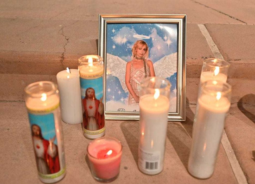 Candles are placed around a photo of cinematographer Halyna Hutchins during a vigil held in her honor at Albuquerque Civic Plaza on October 23, 2021 in Albuquerque, New Mexico. Hutchins was killed on set while filming the movie "Rust" at Bonanza Creek Ranch near Santa Fe, New Mexico on October 21, 2021. The film