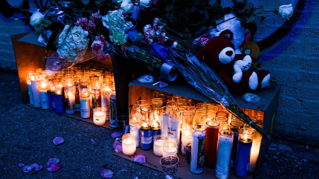 Candles are seen in a makeshift memorial near of the apartment building days after a deadly fire in the Bronx.