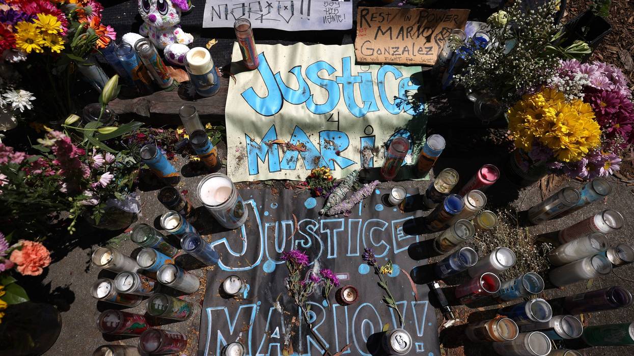 Candles, flowers and photographs are displayed at a memorial for Mario Gonzalez who died after being pinned by Alameda police officers on April 29, 2021 in Alameda, California.