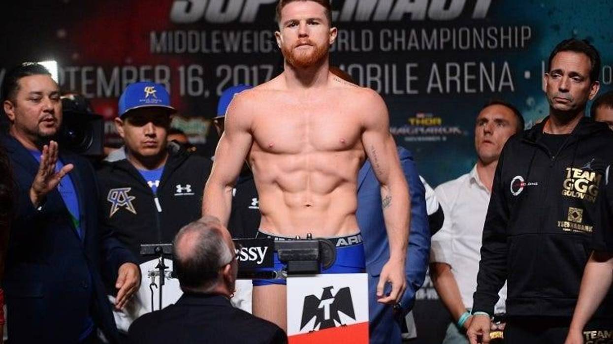Canelo Alvarez weighs in for his upcoming bout against Gennady Golovkin (not pictured) during weigh-ins at MGM Grand Garden Arena.