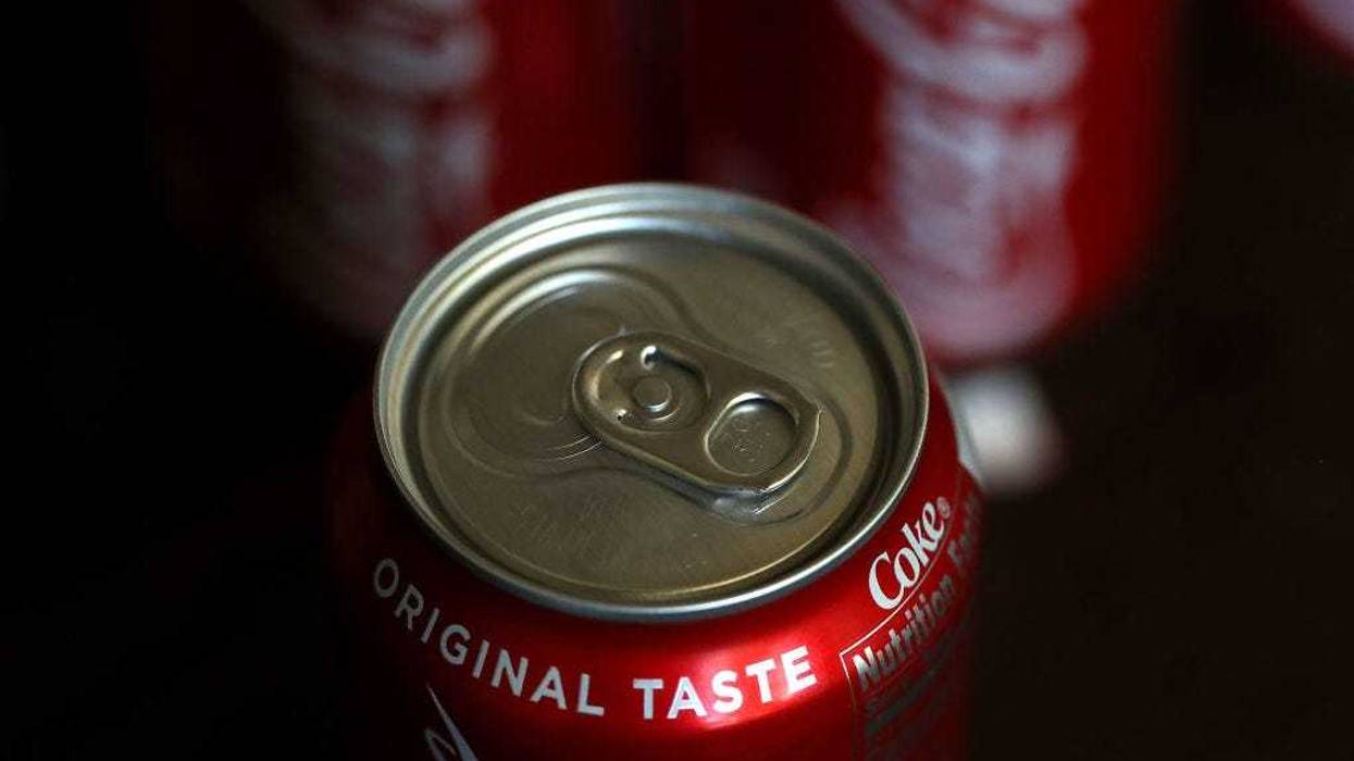Cans of Coca Cola are displayed on July 25, 2018 in San Rafael, California.