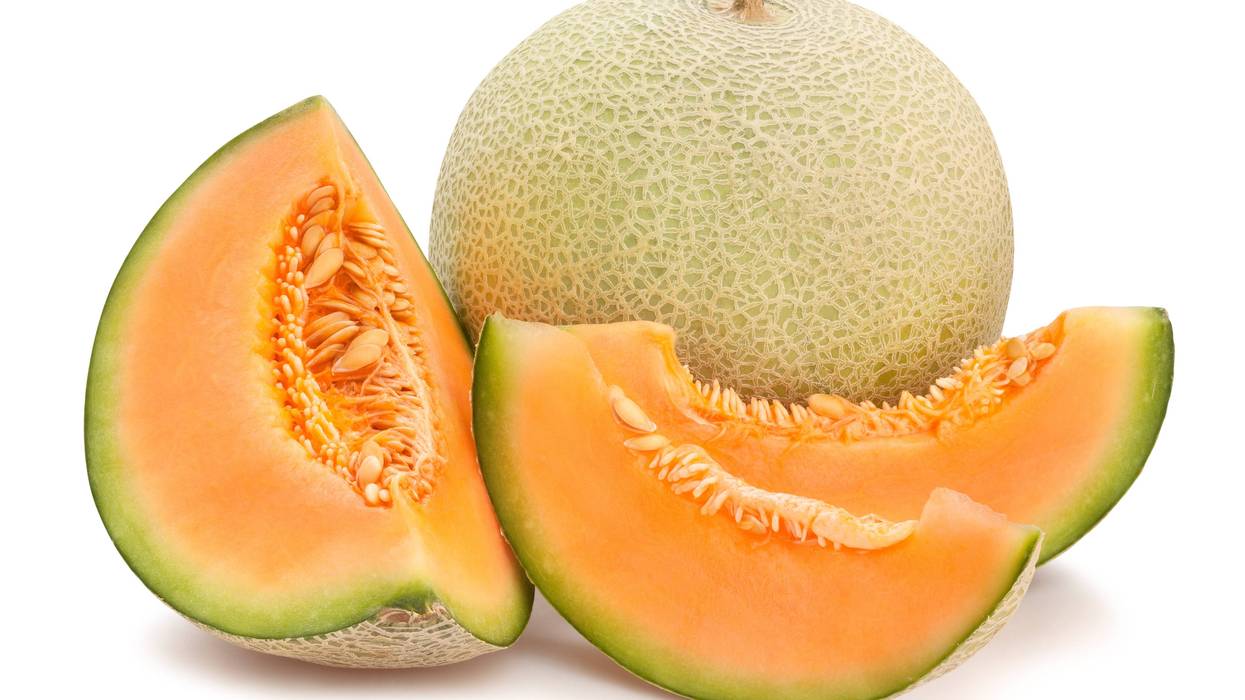 Cantaloupe, cut and whole.