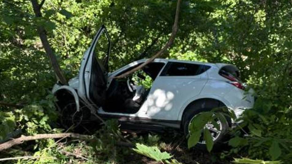 Car crashes just feet away from 50-foot drop in Trafford