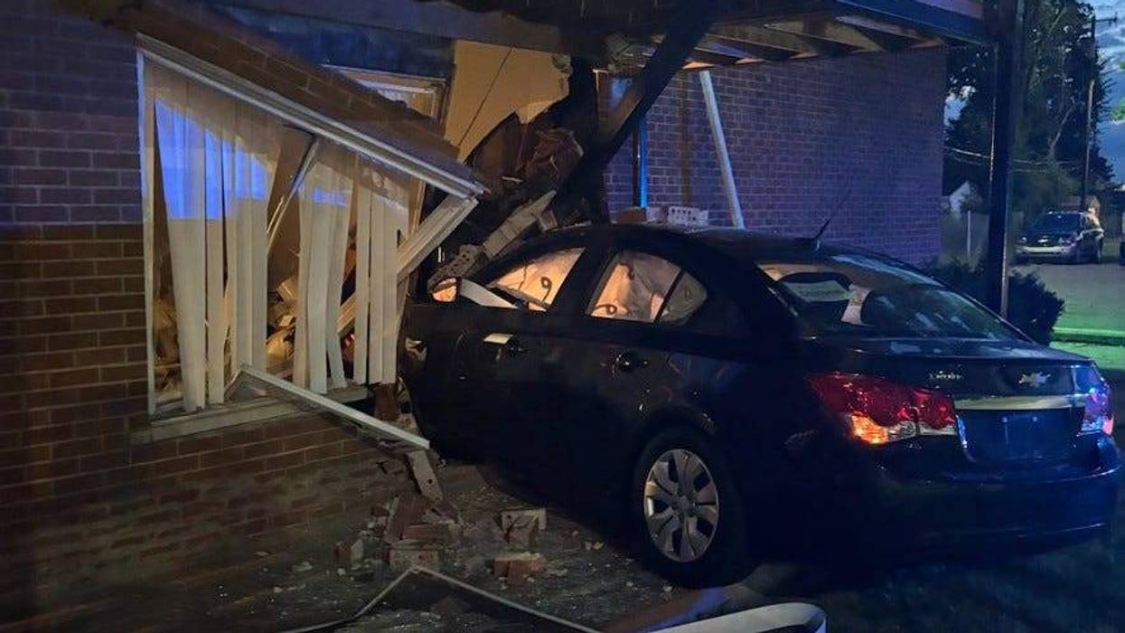 Car crashes into Detroit apartment building
