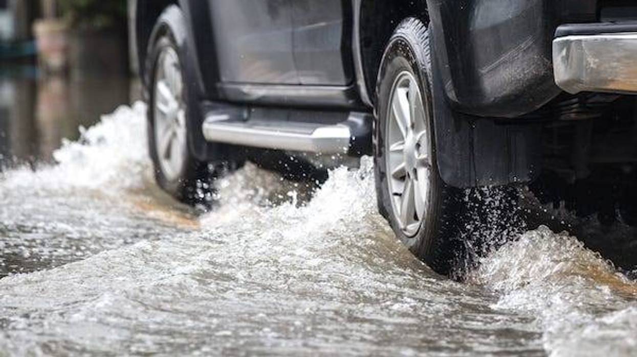 Car driving on a flooded street