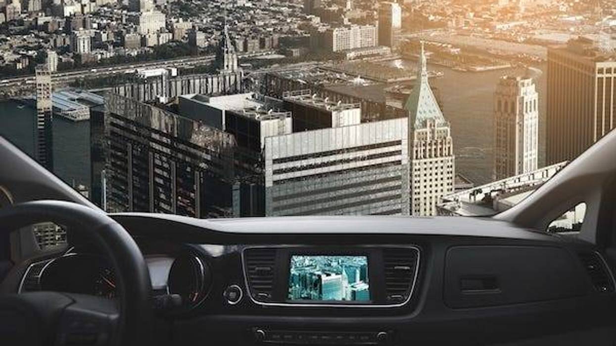 Car flying over a city