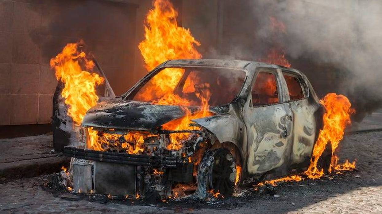 Car on fire, car engulfed in flames