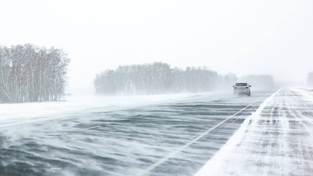 Car on road in snow squall