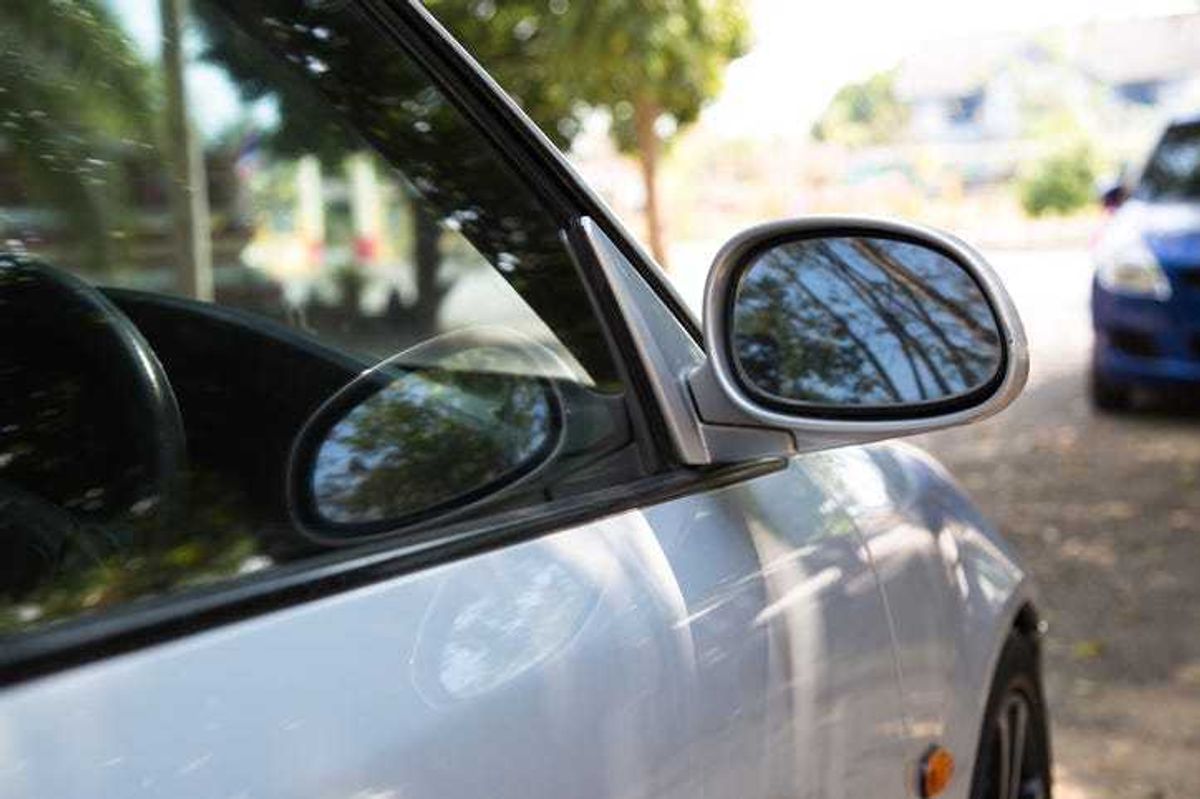 Car parked in the shade on a hot day.