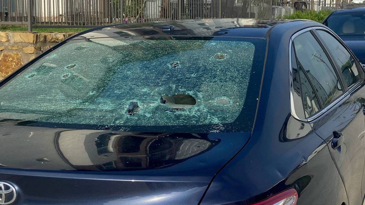 Car with shattered windows from Sunday's hail storm