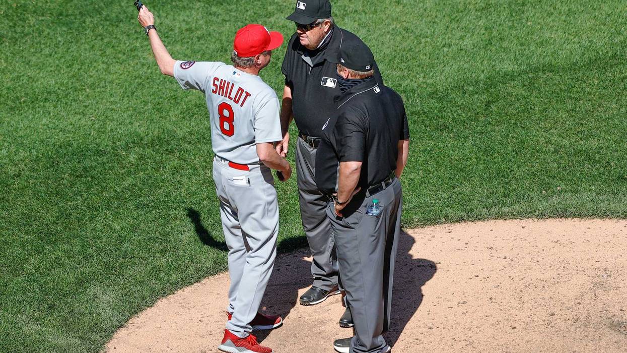 Cardinals Manager Mike Shildt argues with Joe West after Giovanny Gallegos' hat was taken because of a foreign substance on his hat.