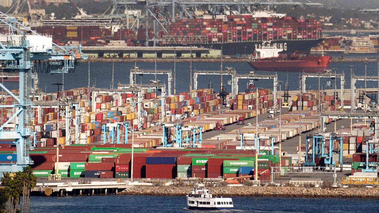Cargo containers wait to be transported after being offloaded at the Port of Los Angeles, Oct 16, 2021 in San Pedro, California