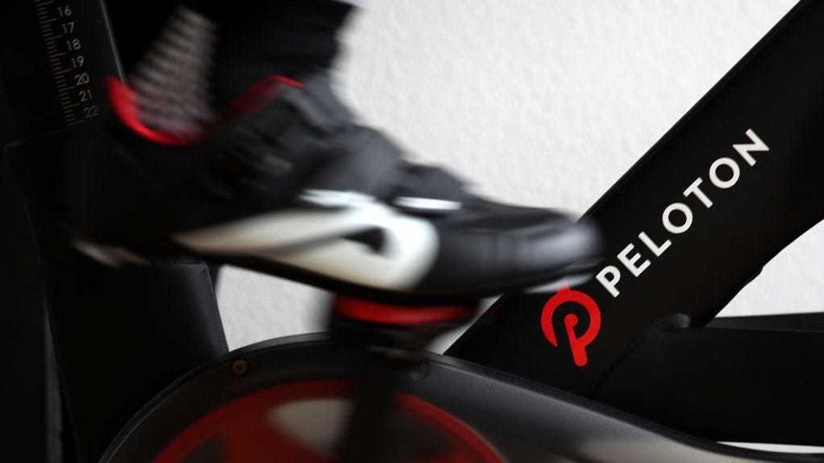 Cari Gundee rides her Peloton exercise bike at her home on April 06, 2020 in San Anselmo, California.