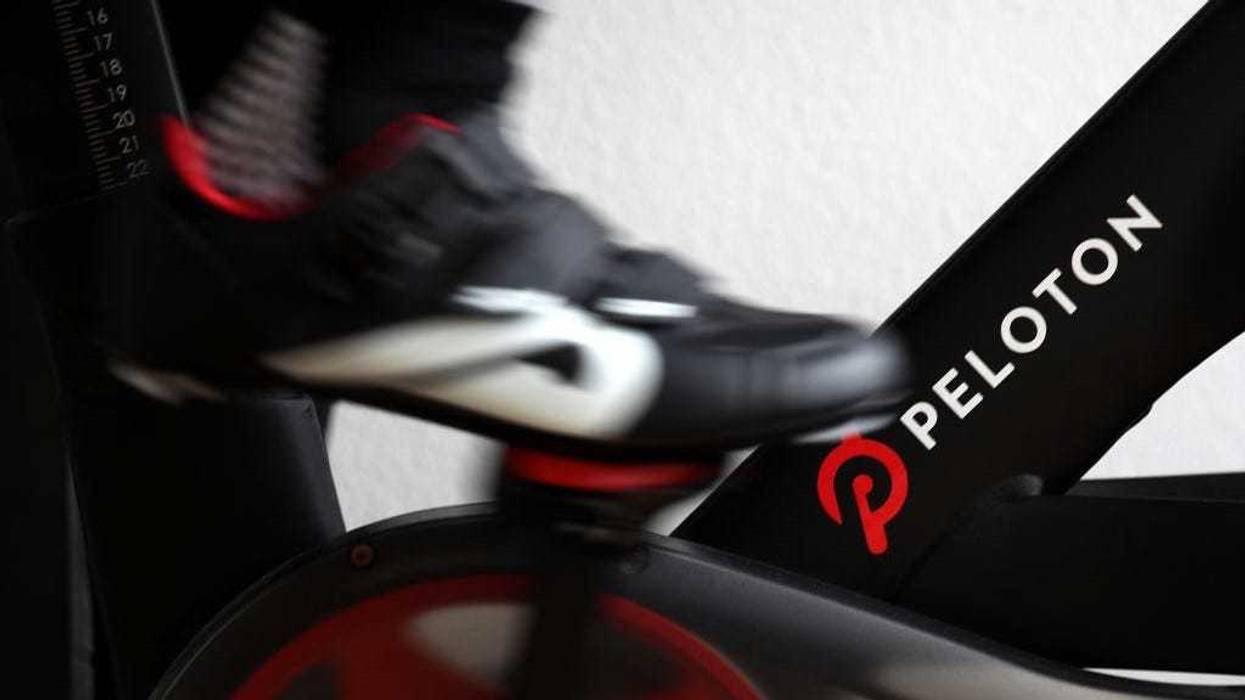 Cari Gundee rides her Peloton exercise bike at her home on April 06, 2020 in San Anselmo, California.