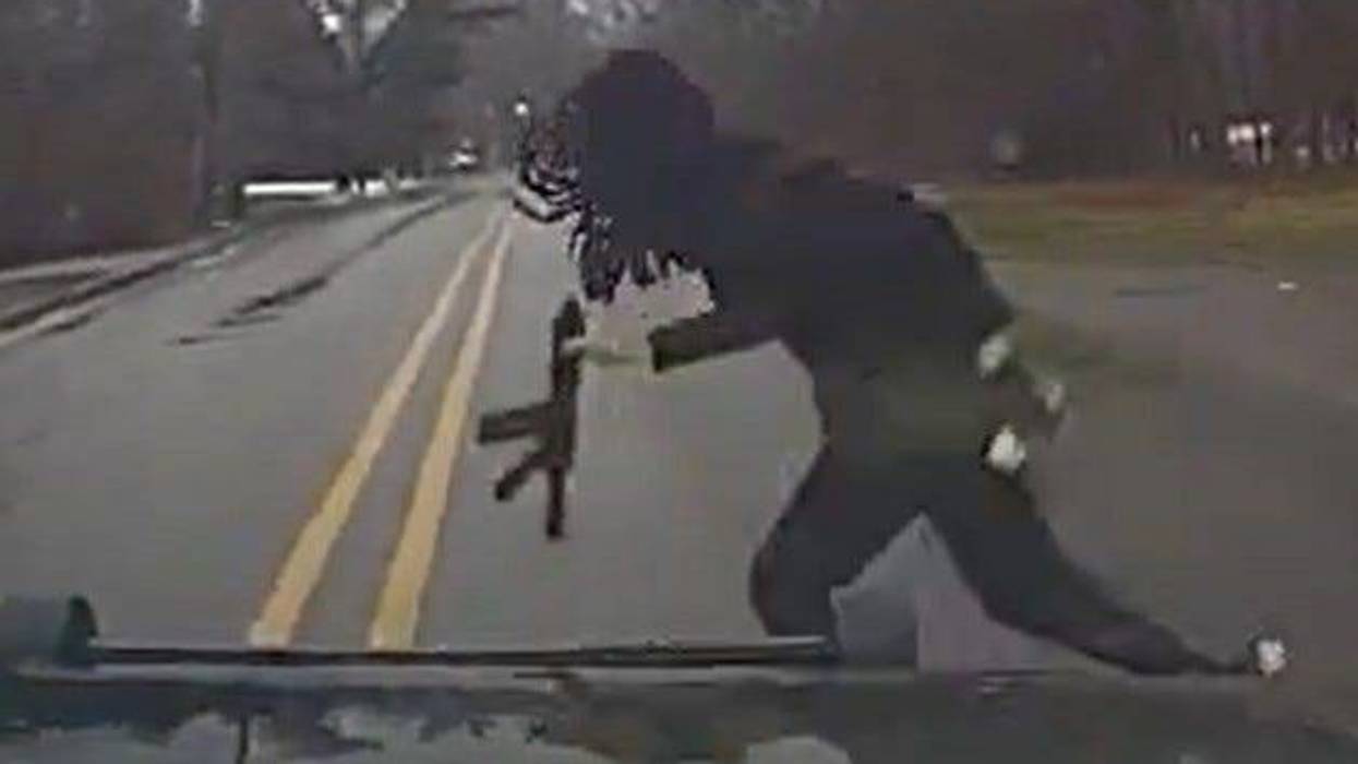 Carjacking suspect runs in front of Southfield police car