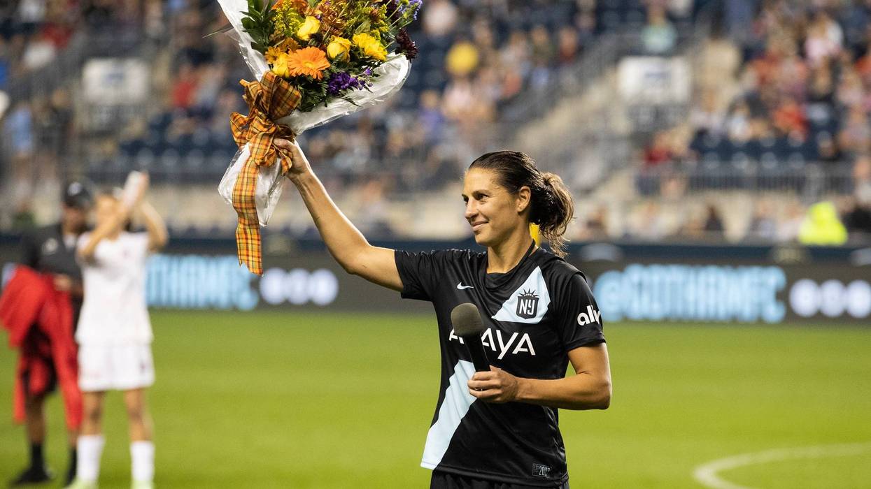 Carli Lloyd holds up a bouquet after the team's NWSL soccer match against the Washington Spirits on Wednesday, Oct. 6, 2021, in Chester, Pa.