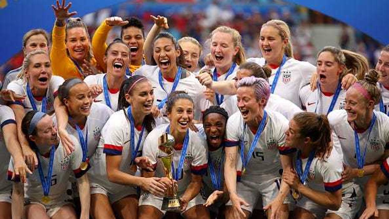 Carli Lloyd lifts the trophy as USA celebrate victory during the 2019 FIFA Women's World Cup.