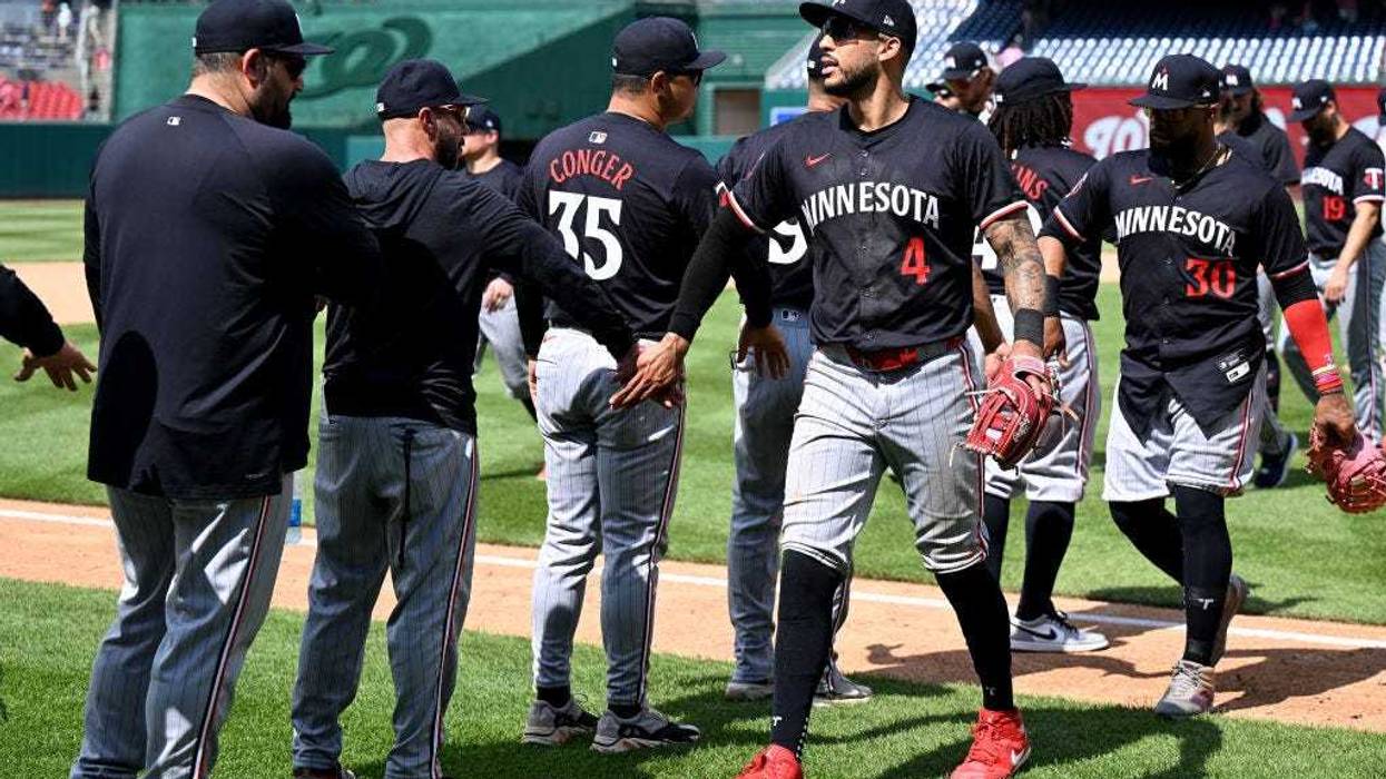 Carlos Correa #4 of the Minnesota Twins celebrates with teammates after a 3-2 victory against the Washington Nationals at Nationals Park on May 22, 2024 in Washington, DC.