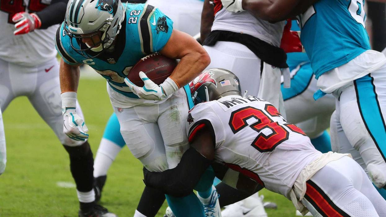 Carolina Panthers running back Christian McCaffrey runs the ball against the Tampa Bay Buccaneers during the third quarter at Raymond James Stadium.