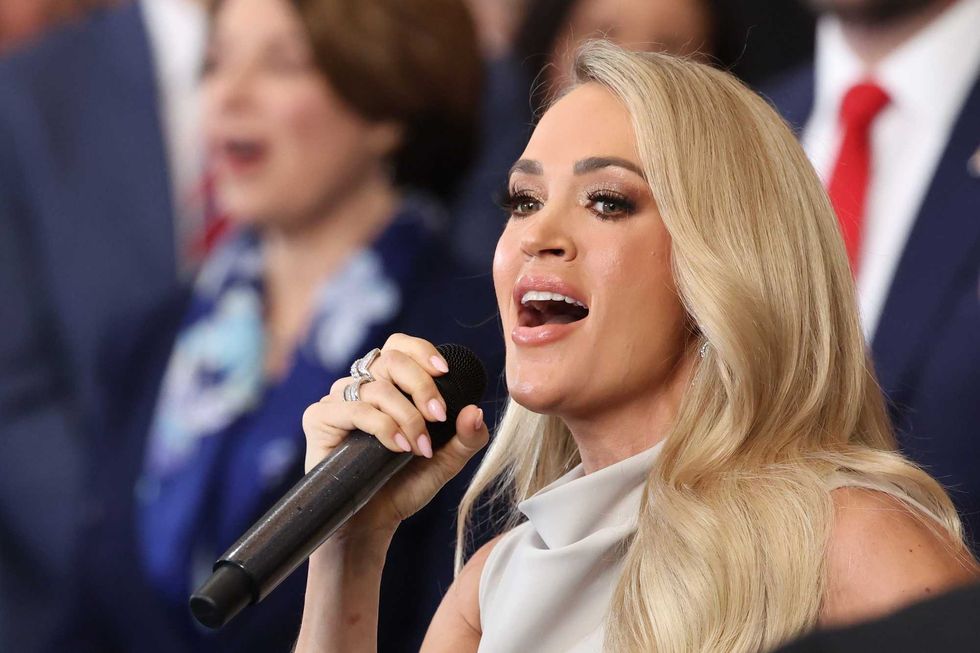 : Carrie Underwood performs "America The Beautiful" during inauguration ceremonies in the U.S. Capitol Rotunda on January 20, 2025 in Washington, DC. Donald Trump takes office for his second term as the 47th president of the United States. (Photo by Kevin Lamarque - Pool/Getty Images)