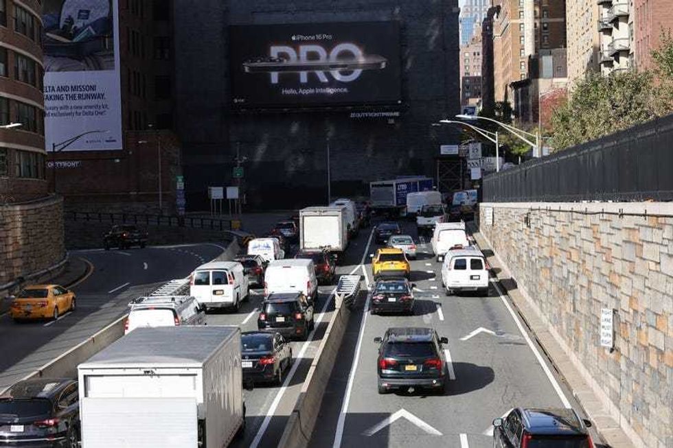Cars and trucks are seen leaving the Queens Midtown Tunnel on Nov. 14, 2024.