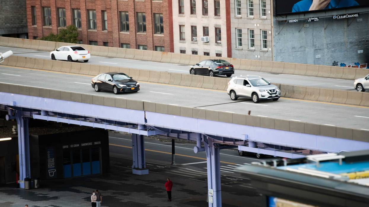 Cars are seen on the FDR Drive by the South Street Seaport in Lower Manhattan