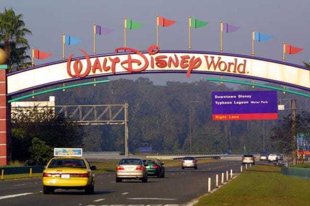 Cars drive into Walt Disney World November 11, 2001 in Orlando, Florida.