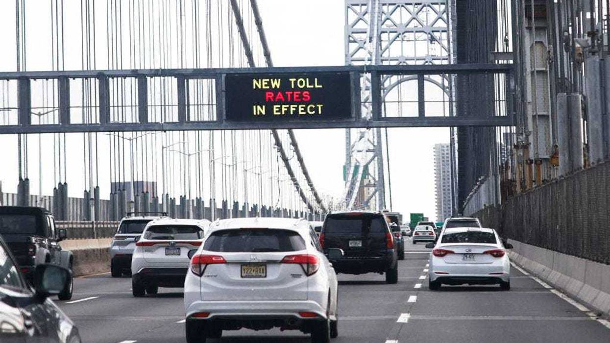 Cars pass under a congestion pricing warning sign on George Washington Bridge as congestion pricing takes effect in New York City on Jan. 5, 2024.