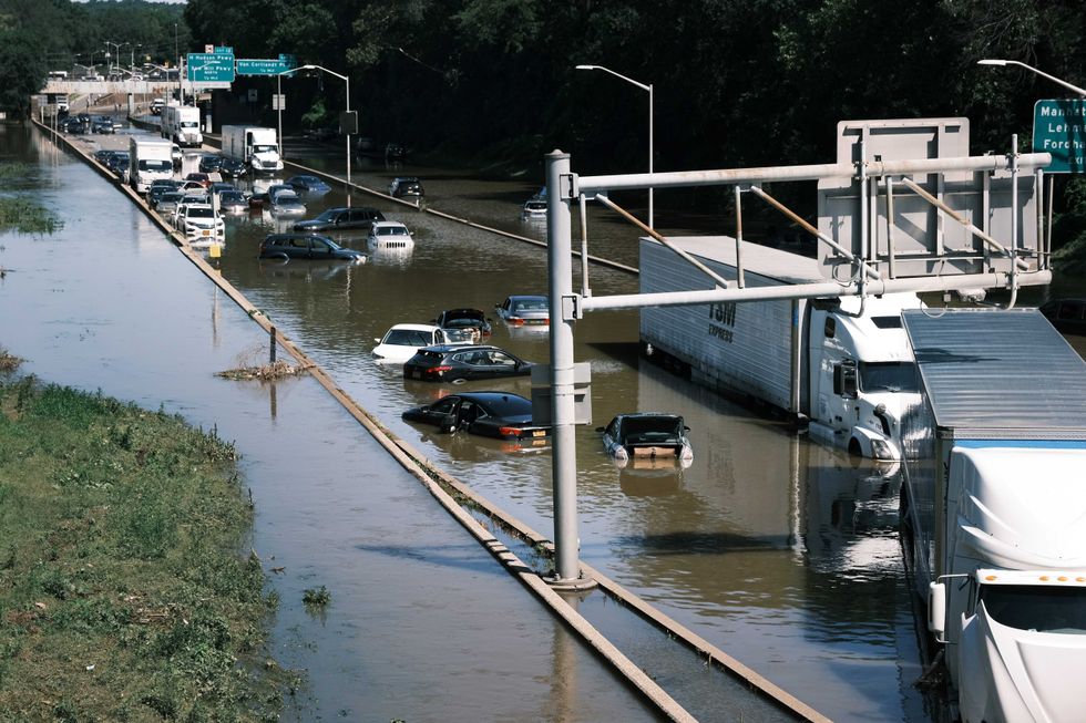 Cars sit abandoned on the flooded Major Deegan Expressway in the Bronx following a night of heavy wind and rain from the remnants of Hurricane Ida on September 02, 2021 in New York City