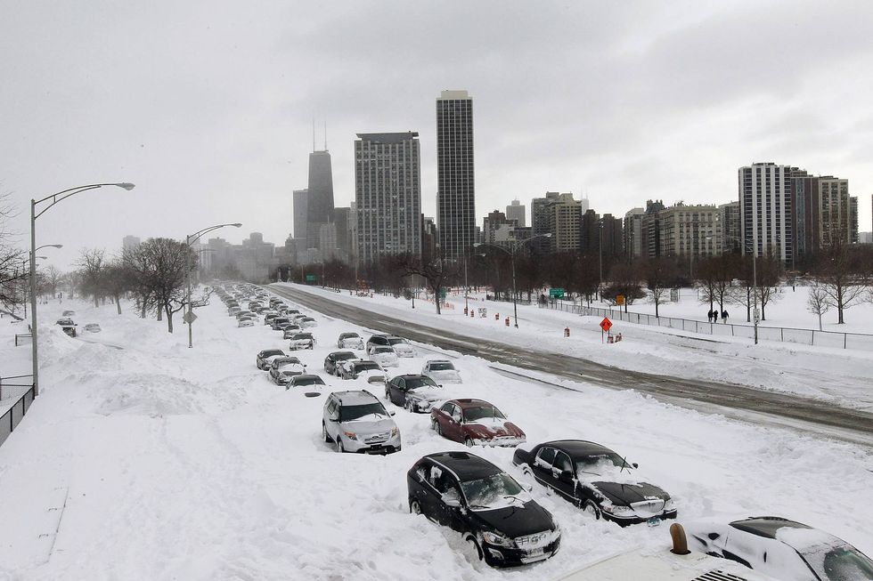 Cars sit in the northbound lanes of Lake Shore Drive after accidents and drifting snow stranded the drivers during last night