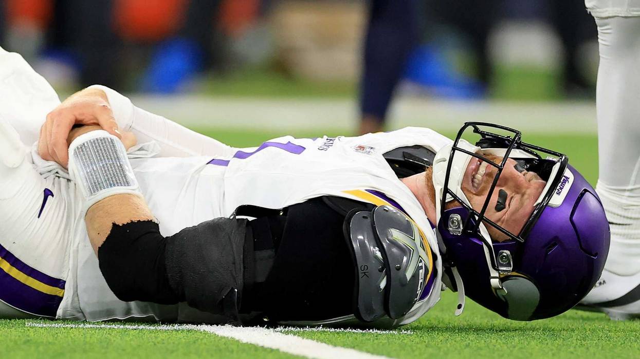 Carson Wentz #11 of the Minnesota Vikings reacts in pain on the ground after a play against the Los Angeles Chargers during the fourth quarter in the game at SoFi Stadium on October 23, 2025 in Inglewood, California.