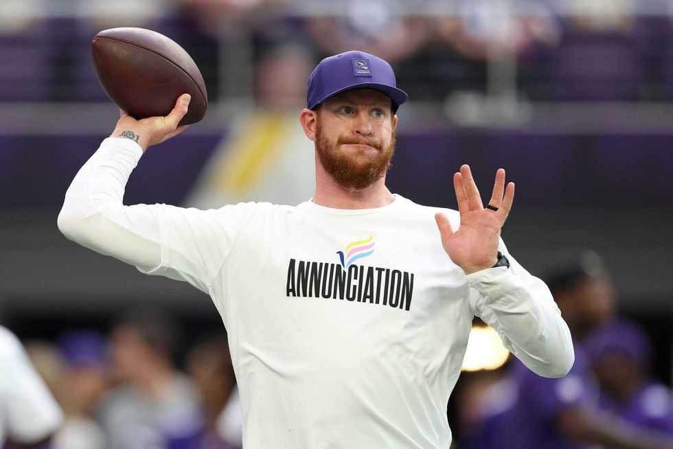 Carson Wentz #11 of the Minnesota Vikings warms up against the Atlanta Falcons before the game at U.S. Bank Stadium on September 14, 2025 in Minneapolis, Minnesota.