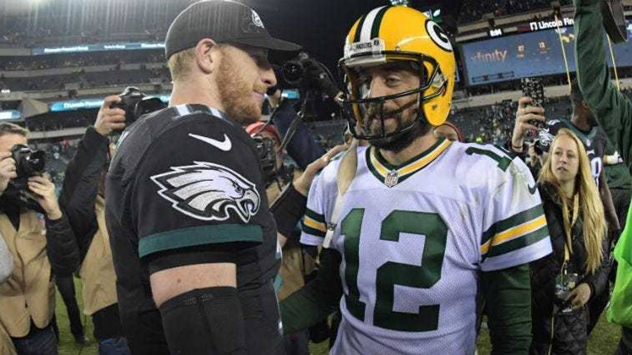 Carson Wentz and Aaron Rodgers shake hands after a NFL football game at Lincoln Financial Field in Philadelphia.