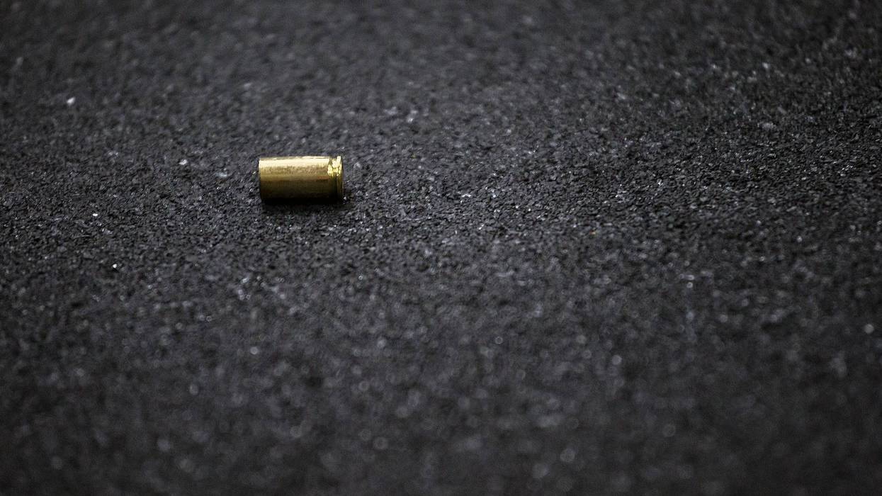 Cases of a bullet lying on the floor of asphalt