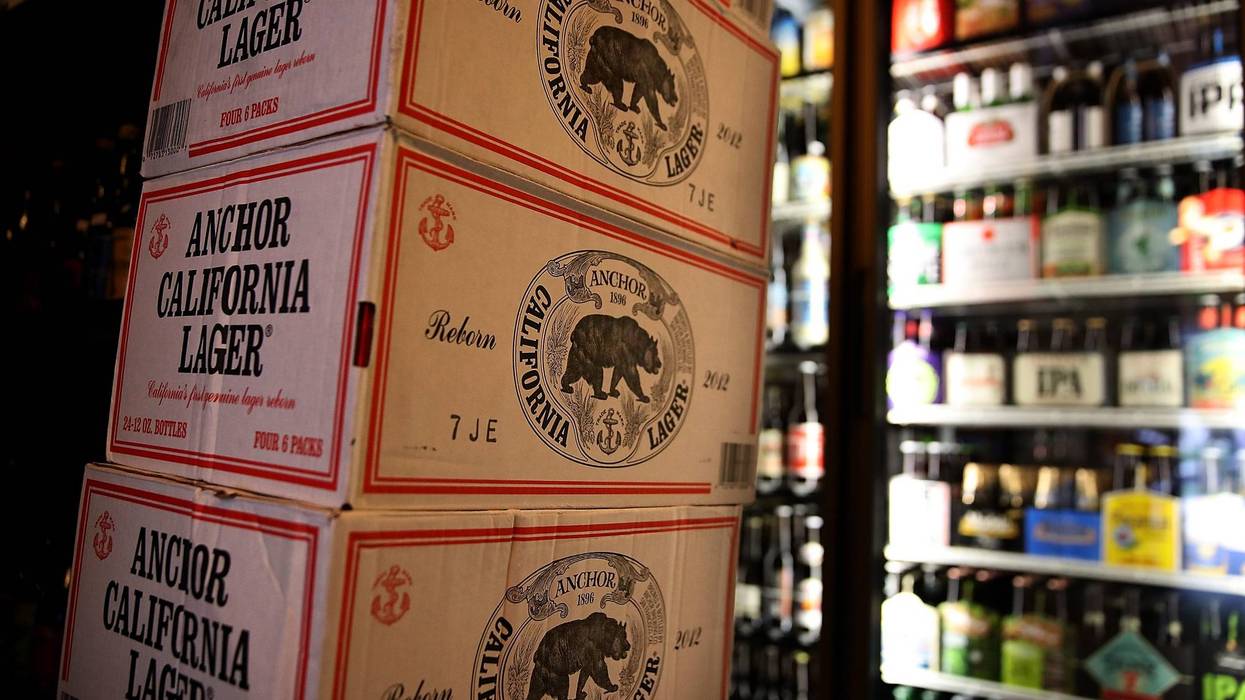 Cases of Anchor Steam California Lager beer are displayed at Coit Liquor on August 3, 2017 in San Francisco, California.