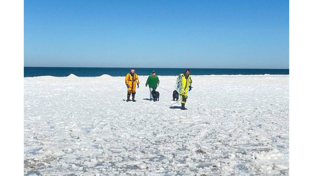 Caseville Firefighters Jared Maust and Tye Tennant helping the victims back to shore