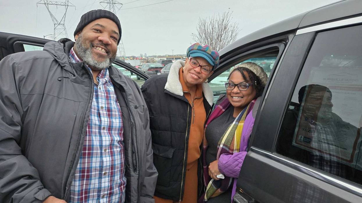 Catherine and Jervis White, founders of Black Roots Sauces & Seasonings, with Sheletta Brundidge (center) and their new van.