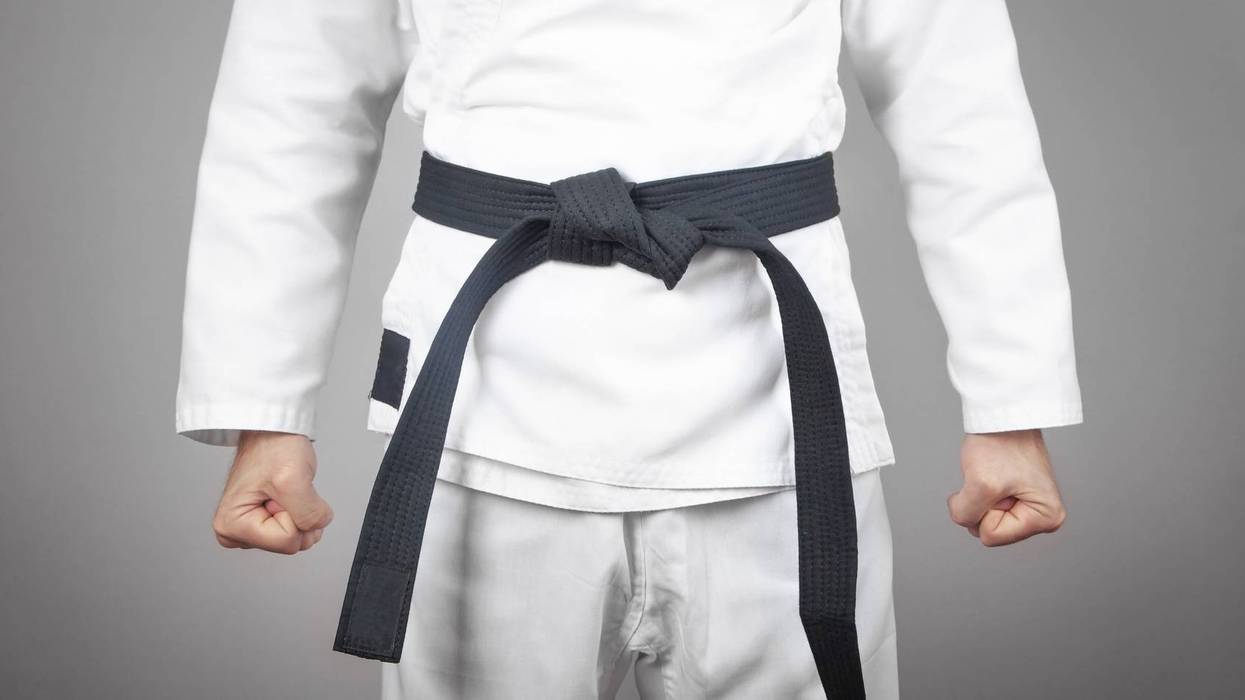 Caucasian male fists. Doing karate. Martial arts