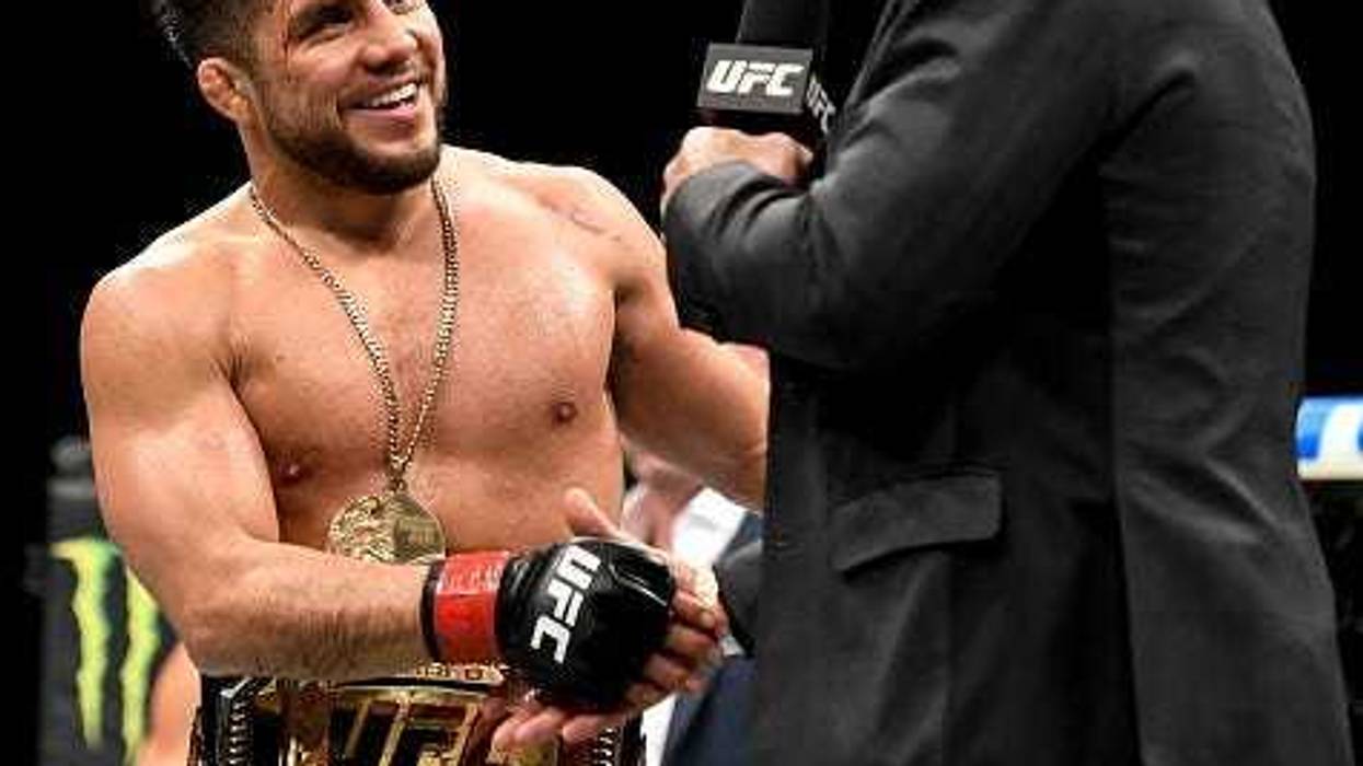 Cejudo and Rogan shake hands.