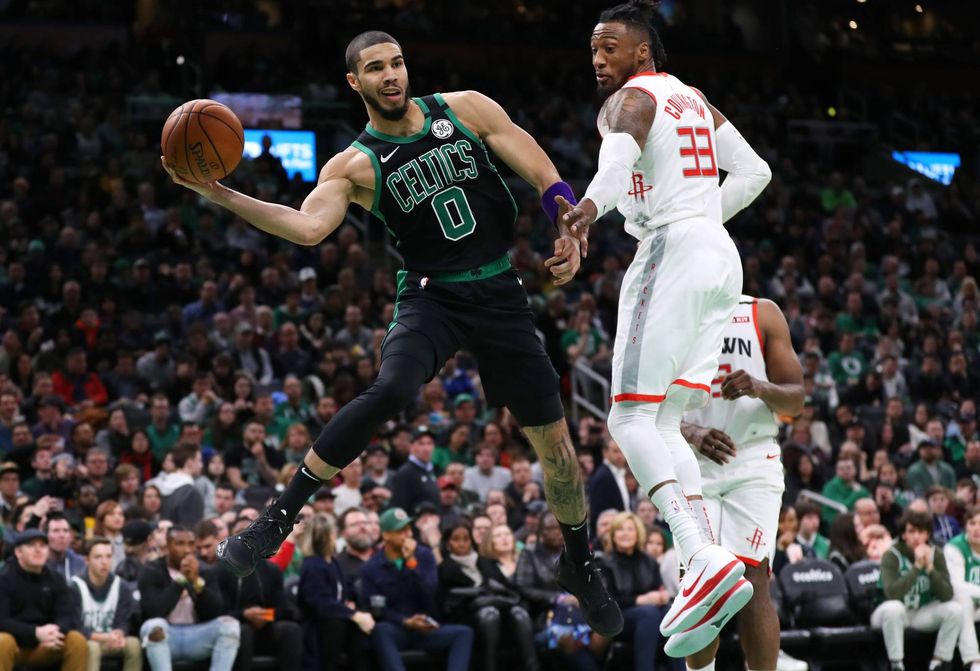 Celtics forward Jayson Tatum looks for a passing lane