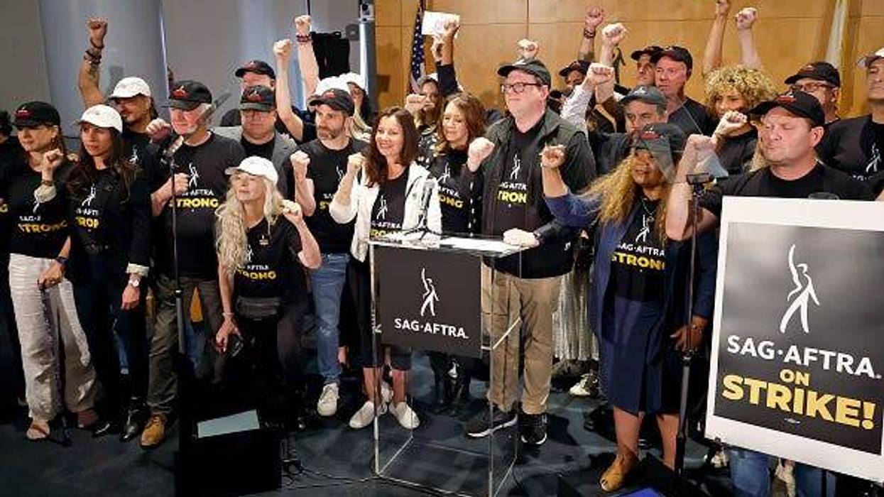 (Center L-R) Frances Fisher, Ben Whitehair, Frances Fisher, SAG President Fran Drescher, Joely Fisher, National Executive Director and Chief Negotiator of SAG-AFTRA Duncan Crabtree-Ireland, Michael Gaston, Michelle Hurd, and SAG-AFTRA members are seen as SAG-AFTRA National Board holds a press conference for vote on recommendation to call a strike regarding the TV/Theatrical contract at SAG-AFTRA on July 13, 2023 in Los Angeles, California.