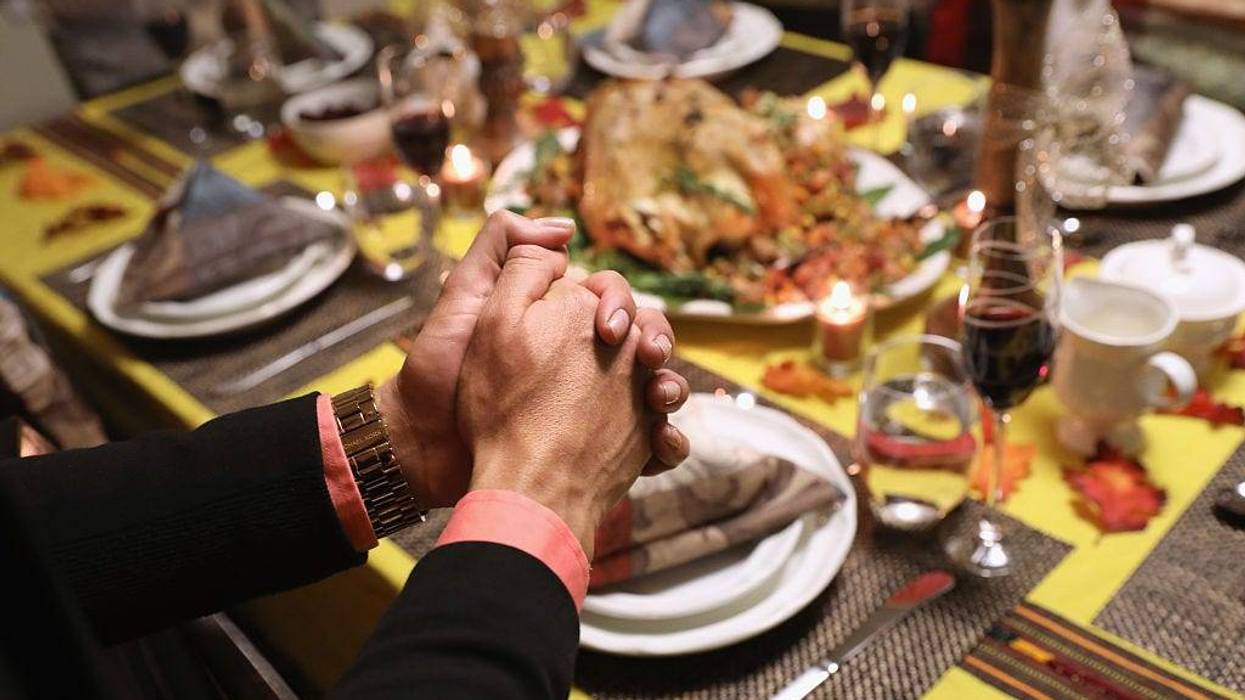 Central American immigrants and their families pray before Thanksgiving dinner on November 24, 2016 in Stamford, Connecticut.