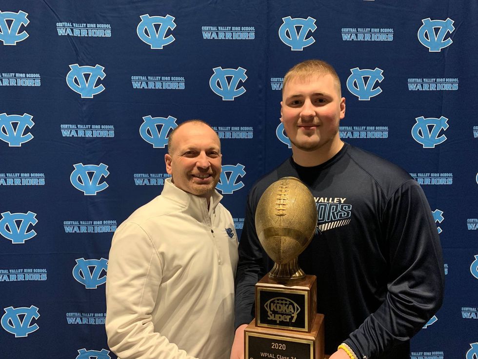Central Valley head coach Mark Lyons (L) and defensive lineman Sean FitzSimmons (R) pose with Sean