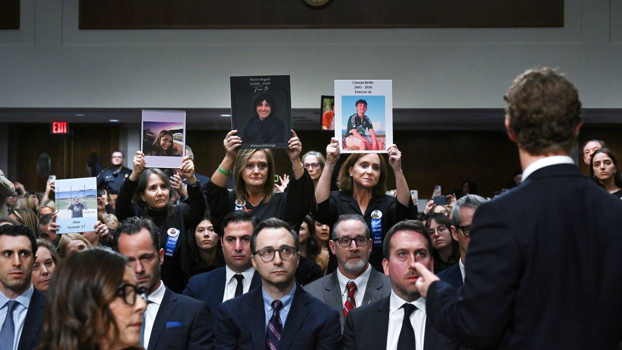 CEO of Meta, Mark Zuckerberg acknowledges family members as they hold up photos during a Senate Judiciary Committee hearing with representatives of social media companies at the Dirksen Senate Office Building on Wednesday January 31, 2024 in Washington, DC.