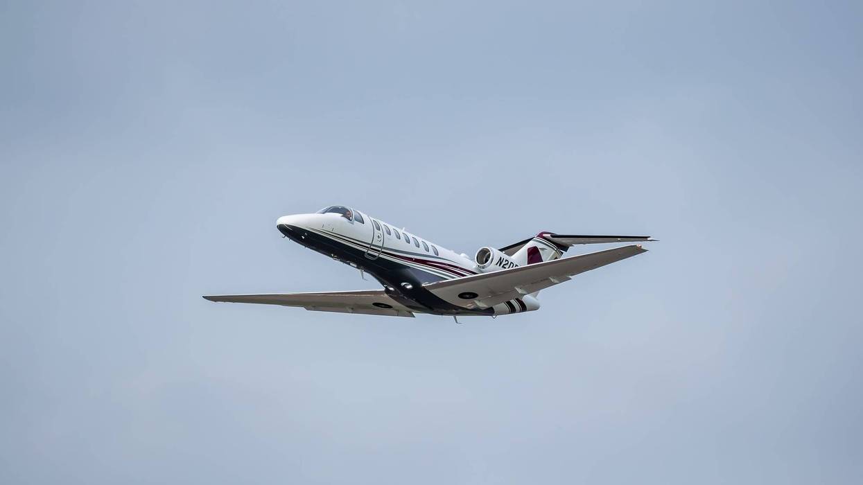 cessna business jet flying in sky