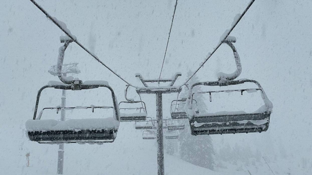 Chair lifts collect fresh snow as an atmospheric river storm passes through Northern California.