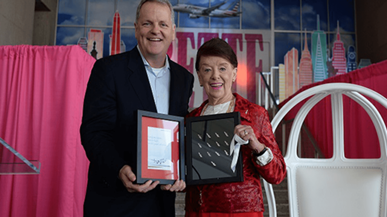 Chairman and CEO Doug Parker presents Bette Nash with a complete set of American Airlines anniversary pins for years 1-60.