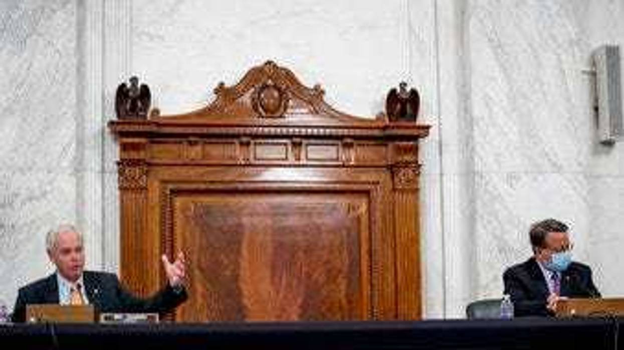 Chairman Sen. Ron Johnson, R-Wis., left, accompanied by Ranking Member Sen. Gary Peters., right, speaks as the Senate Homeland Security and Governmental Affairs committee meets on Capitol Hill. (AP Photo/Andrew Harnik)