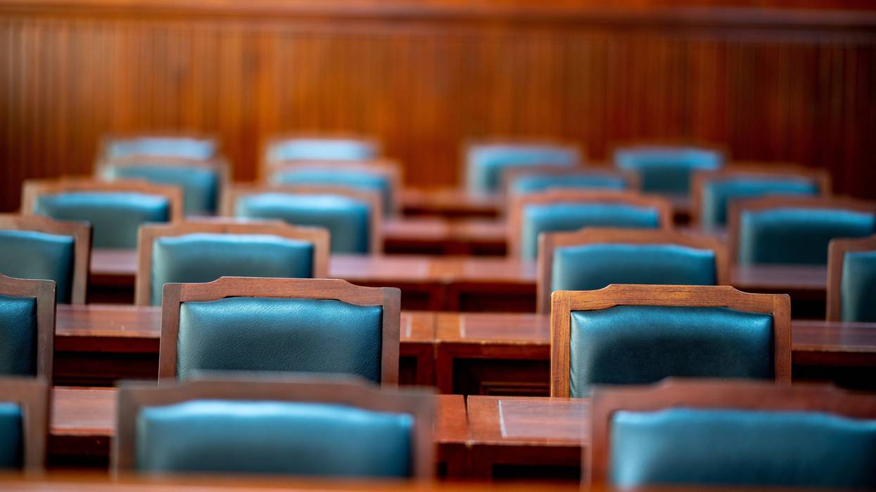Chairs and wooden tables in the courtroom